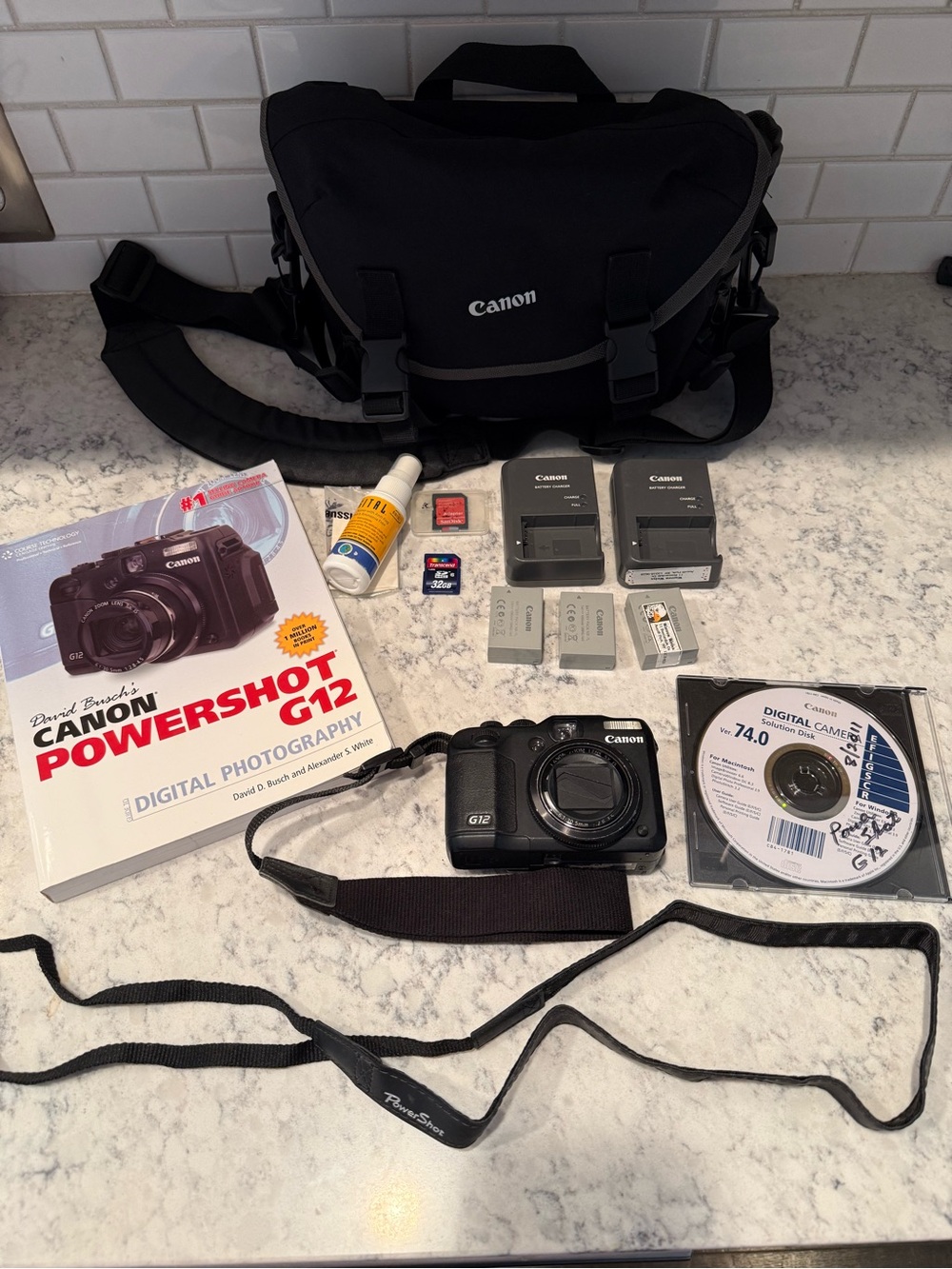 Canon Black PowerShot G12 Digital Camera with lots of extras- tested and working